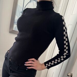 Black Turtleneck Sweater with Checkered Sleeves